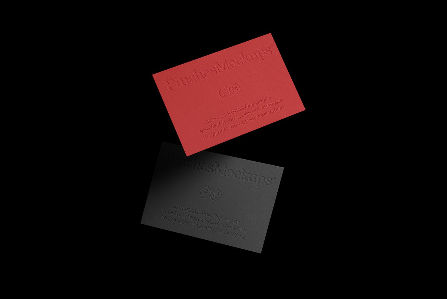 Elegant business card mockup with red and black cards on a dark background showcasing embossed logo design for designers' presentations.